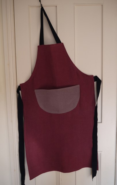 Two colour plain purple linen apron with a pocket